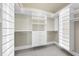 Custom closet with adjustable shelves, drawers, and ample storage space to maximize organization at 10529 Sablewood Dr # 111, Raleigh, NC 27617
