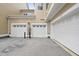 Exterior view of multiple single car garages of a condo/townhouse complex, each with a numbered door at 10529 Sablewood Dr # 111, Raleigh, NC 27617