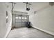 An empty two car garage with concrete floors and an automatic door opener at 10529 Sablewood Dr # 111, Raleigh, NC 27617