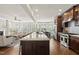 Bright kitchen with a large island overlooks the living area, featuring stainless appliances and ample counter space at 10529 Sablewood Dr # 111, Raleigh, NC 27617