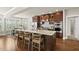 Spacious kitchen boasts a large island with seating, granite countertops, and stainless steel appliances at 10529 Sablewood Dr # 111, Raleigh, NC 27617