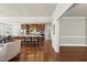 Open kitchen with a large island, hardwood floors, stainless steel appliances, and modern finishes at 10529 Sablewood Dr # 111, Raleigh, NC 27617
