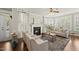 Bright living room with fireplace, plantation shutters and natural light at 10529 Sablewood Dr # 111, Raleigh, NC 27617