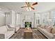 Beautiful living room with hardwood floors, fireplace, plantation shutters and natural light at 10529 Sablewood Dr # 111, Raleigh, NC 27617
