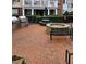 Outdoor gathering area with a built-in grill, fire pit, benches, and picnic table provides a perfect space for entertaining guests at 10529 Sablewood Dr # 111, Raleigh, NC 27617