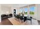 Dining room is great for entertaining, featuring many windows, modern furnishings and decorative moss balls at 10538 Pleasant Branch Dr # 28, Raleigh, NC 27614