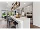 Modern kitchen with stainless steel appliances, a central island with seating, and views into other living areas at 10538 Pleasant Branch Dr # 28, Raleigh, NC 27614