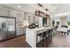 Open kitchen featuring stainless steel appliances, a central island with seating, and modern finishes at 10538 Pleasant Branch Dr # 28, Raleigh, NC 27614