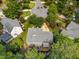 Aerial view of home featuring a cozy deck with a seating area and landscaped yard in a lush neighborhood at 106 Fawley Ct, Cary, NC 27519