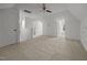 Finished attic space with neutral carpet, ceiling fan, and natural light from a window at 106 Fawley Ct, Cary, NC 27519