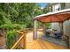Multi-level deck with covered seating area provides a relaxing outdoor living space at 106 Fawley Ct, Cary, NC 27519