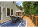 Spacious back deck for outdoor dining and lounging with views of the backyard and mature trees at 106 Fawley Ct, Cary, NC 27519