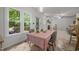Bright dining area with large windows and access to a deck leads into a spacious living room at 106 Fawley Ct, Cary, NC 27519