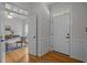 Inviting entryway with hardwood floors, white trim, and views into the office space at 106 Fawley Ct, Cary, NC 27519