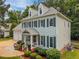 Well-maintained two-story home with pristine siding and landscaped front yard featuring lush green shrubbery at 106 Fawley Ct, Cary, NC 27519