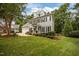 Charming two-story home with manicured lawn and lush landscaping creates a welcoming curb appeal at 106 Fawley Ct, Cary, NC 27519