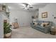 Inviting living room with a cozy fireplace, comfortable seating, and a ceiling fan for added comfort at 106 Fawley Ct, Cary, NC 27519