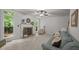 Spacious living room with a fireplace, large windows, and stylish decor offers a comfortable living space at 106 Fawley Ct, Cary, NC 27519