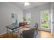 Bright office space with hardwood floors, neutral walls, and ample natural light from the windows at 106 Fawley Ct, Cary, NC 27519