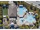 An aerial view of community recreational facilities, featuring multiple pools, tennis courts, and clubhouse at 106 Painted Turtle Ln, Cary, NC 27519