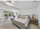 Bright bedroom featuring neutral carpet, tray ceilings, and a work station with large windows offering natural light at 106 Painted Turtle Ln, Cary, NC 27519