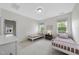Bright bedroom with two twin beds, natural light, neutral walls, and cozy decor at 106 Painted Turtle Ln, Cary, NC 27519
