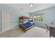 The bedroom features bright blue walls, a bunk bed, a desk, and ample natural light at 106 Painted Turtle Ln, Cary, NC 27519