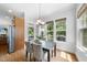 Cozy dining area with natural light, and a view of the covered back porch at 106 Painted Turtle Ln, Cary, NC 27519