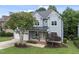 Charming two-story home with a covered front porch and a well-manicured lawn at 106 Painted Turtle Ln, Cary, NC 27519