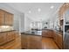 Bright kitchen featuring wood cabinets, granite countertops, and stainless steel appliances at 106 Painted Turtle Ln, Cary, NC 27519