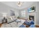 Bright living room featuring a fireplace and an open floor plan at 106 Painted Turtle Ln, Cary, NC 27519