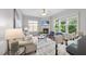 Bright living room featuring a fireplace and an open floor plan with ample natural light at 106 Painted Turtle Ln, Cary, NC 27519