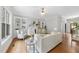 Open-concept living room with built-in bookshelves and hardwood flooring, creating a cozy atmosphere at 106 Painted Turtle Ln, Cary, NC 27519