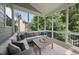 Relaxing screened-in porch with comfortable seating, offering a peaceful outdoor space at 106 Painted Turtle Ln, Cary, NC 27519