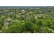An aerial of a neighborhood featuring a canopy of trees and homes of different colors, sizes, and shapes at 1105 Hawthorne Ln, Burlington, NC 27215