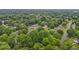 An aerial view of a neighborhood that shows a canopy of mature trees in a residential area at 1105 Hawthorne Ln, Burlington, NC 27215