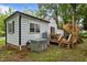 Back exterior featuring a deck, small patio, and AC unit at 1105 Hawthorne Ln, Burlington, NC 27215
