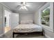 Cozy bedroom featuring neutral walls, a ceiling fan, and new carpeting at 1105 Hawthorne Ln, Burlington, NC 27215