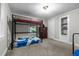 Neutral bedroom features a bunk bed, dresser, and built-in shelving at 1105 Hawthorne Ln, Burlington, NC 27215