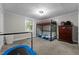 Neutral bedroom features a bunk bed, dresser, and trampoline for entertainment at 1105 Hawthorne Ln, Burlington, NC 27215