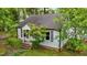A beautiful view of this home's architecture surrounded by lush greenery at 1105 Hawthorne Ln, Burlington, NC 27215