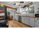 Eat-in kitchen with butcher block countertops, white cabinets, and stainless steel appliances at 1105 Hawthorne Ln, Burlington, NC 27215