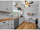 Kitchen with butcher block countertops, white cabinets, and stainless steel appliances at 1105 Hawthorne Ln, Burlington, NC 27215