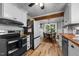 Eat-in kitchen with butcher block countertops, white cabinets, and stainless steel appliances at 1105 Hawthorne Ln, Burlington, NC 27215