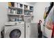 Laundry room featuring white washer and dryer, and lots of storage at 1105 Hawthorne Ln, Burlington, NC 27215