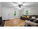 A well-lit living room featuring hardwood floors and views to the exterior at 1105 Hawthorne Ln, Burlington, NC 27215
