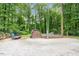 Spacious backyard features a shed and is surrounded by trees, providing privacy at 1109 Buckingham Rd, Garner, NC 27529