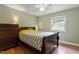 Comfortable bedroom features a ceiling fan, window, and wooden floors at 1109 Buckingham Rd, Garner, NC 27529