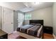 Bedroom features a window, ceiling fan, and two closets at 1109 Buckingham Rd, Garner, NC 27529