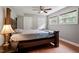Spacious bedroom features hardwood floors, a ceiling fan, and natural light at 1109 Buckingham Rd, Garner, NC 27529